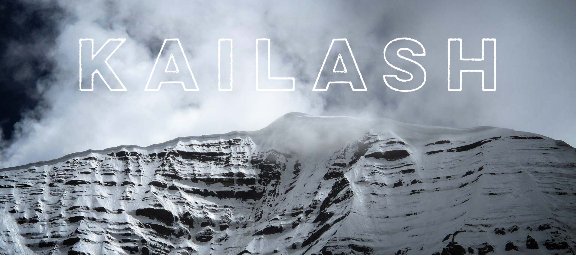 The summit of Mount Kailash with text reading KAILASH
