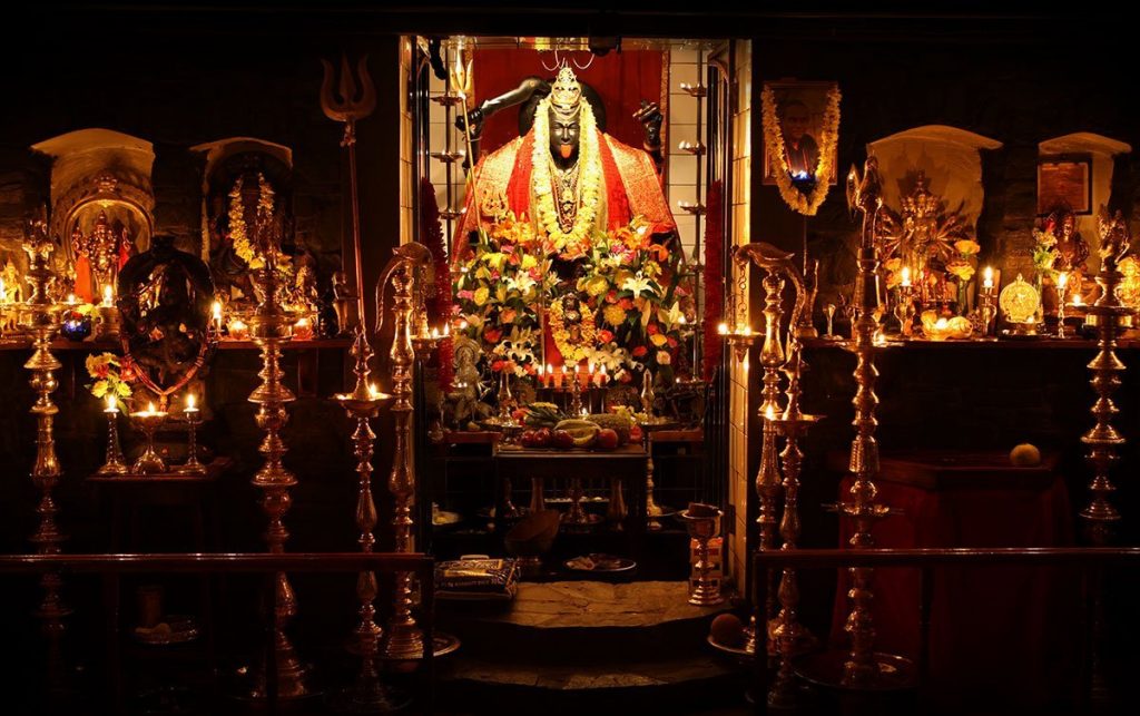 A wide angle view of the gopurum in the Maha Shakti Temple at Skanda Vale, showing the main muthi of Maha Kali and niches for the other temple deities