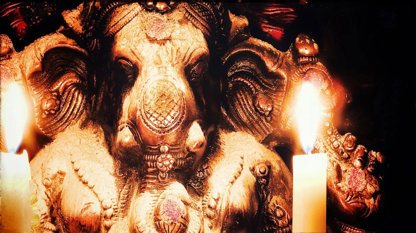 Lord Ganesh A murthi of Ganesh with vibhuti and a candle